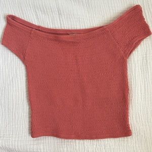 Smocked salmon pink top. Super stretchy and snug around the ribs